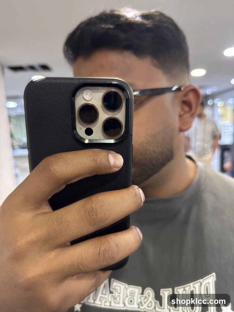 Mirror selfie with phone in hand