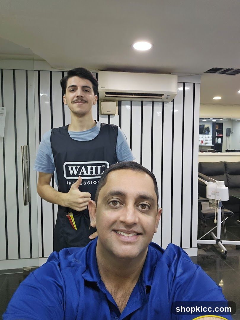 Barber Shop Interior with Staff and Customer