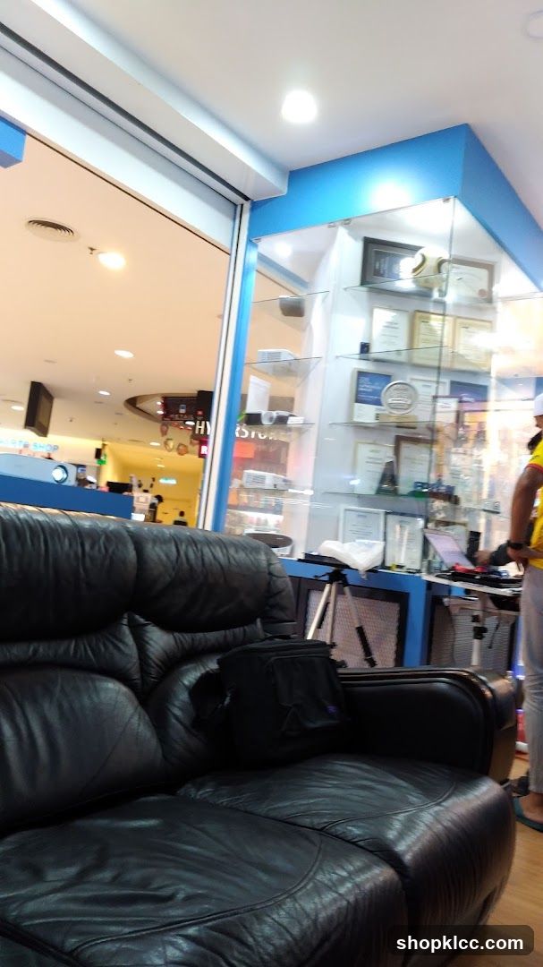 Interior of a shop with display case and seating area