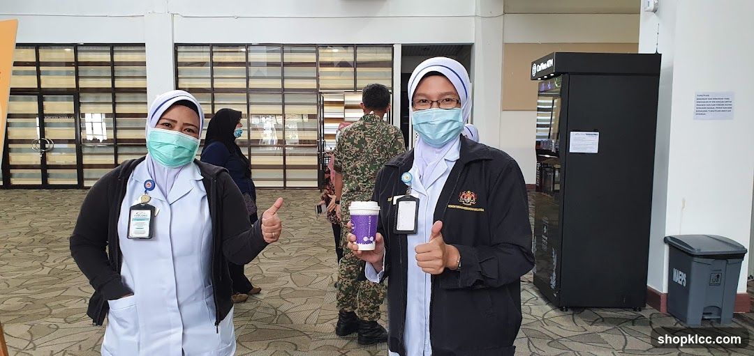 Two nurses giving thumbs up