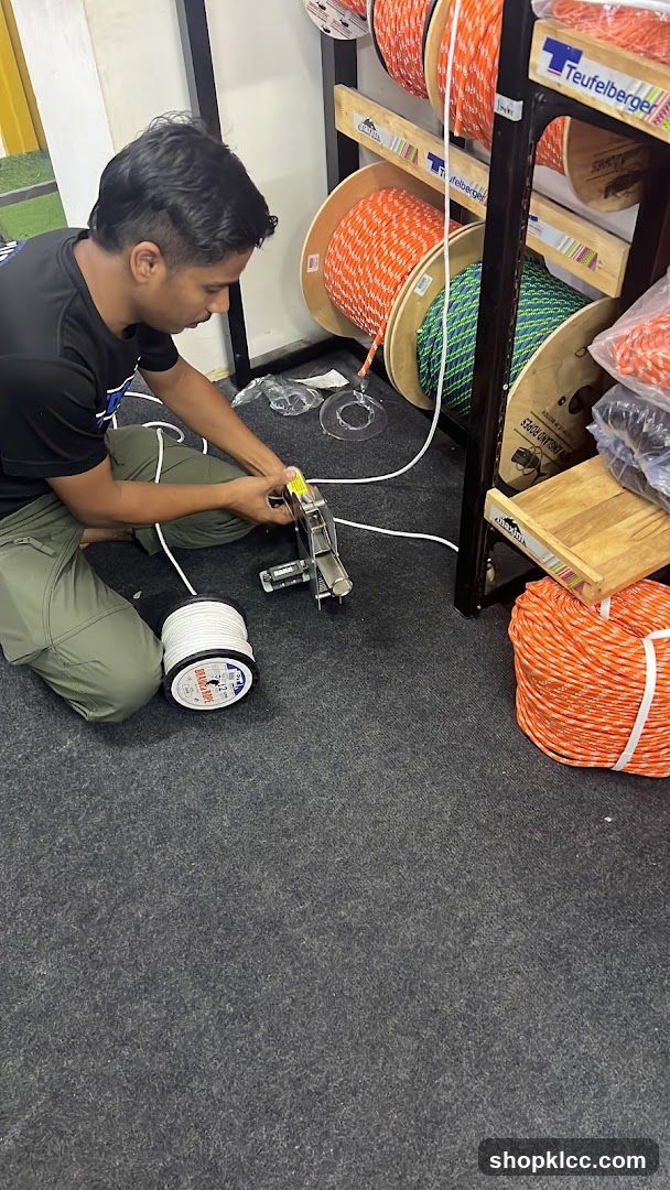 Man working with rope in a store
