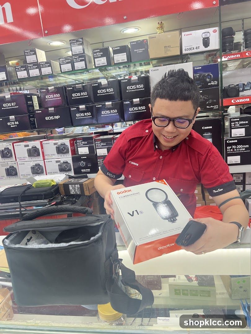 Canon Store Interior with Staff Displaying Product