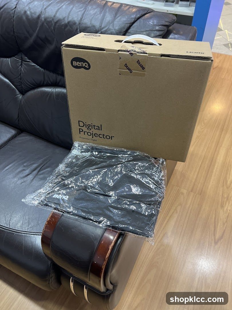 BenQ Digital Projector Box on Leather Sofa