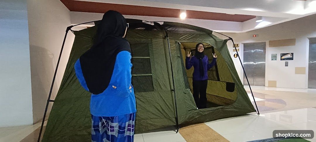 Two people with a tent