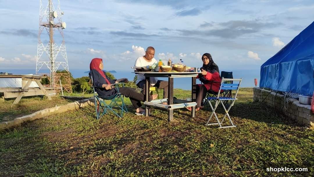 People having a picnic on a hilltop