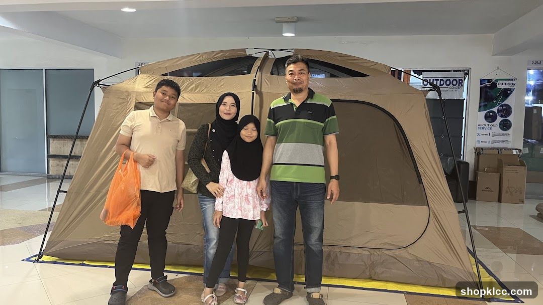 Family Poses in Front of a Tent