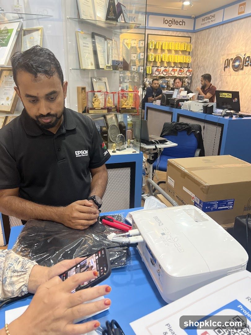 Tech Store Interior with Epson and Logitech Branding