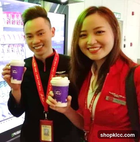 Two people holding coffee cups