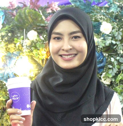 Woman holding a coffee cup