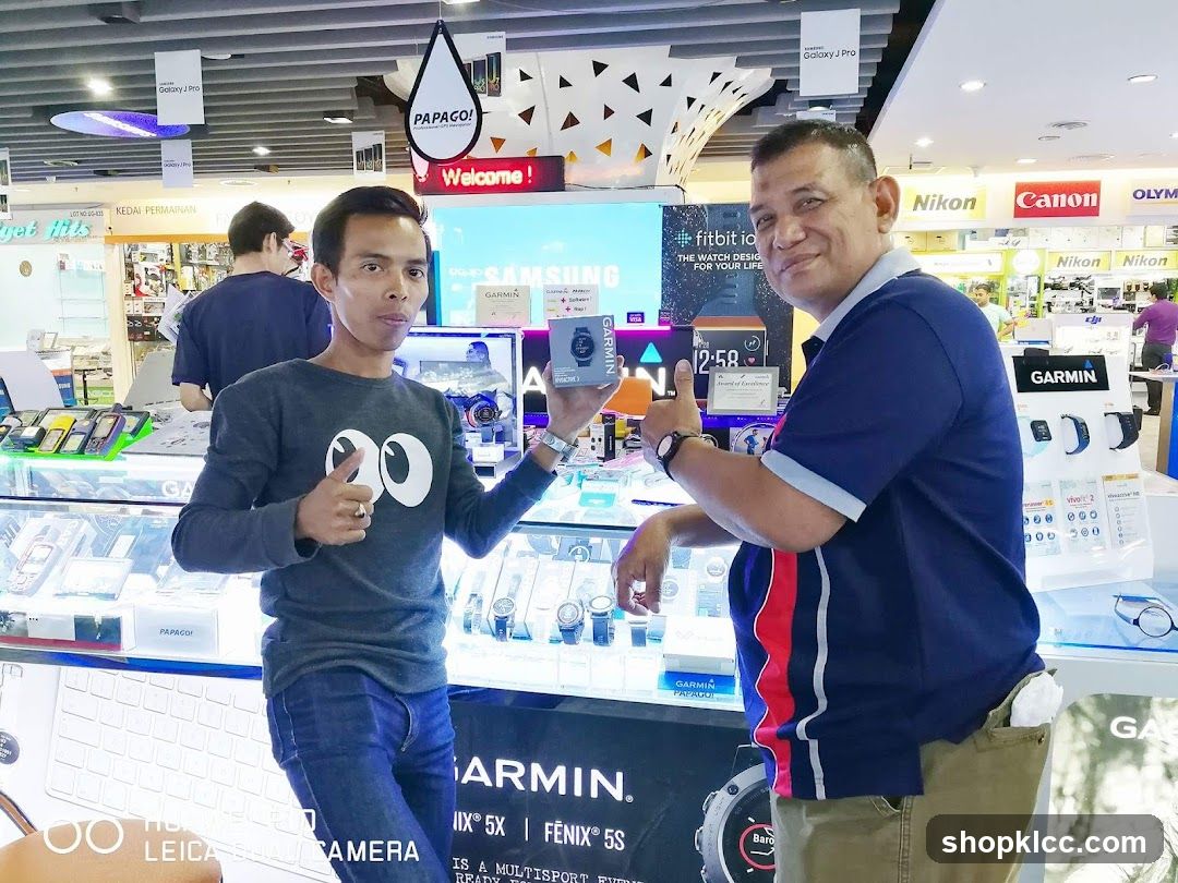 Electronics Store Interior with Staff Displaying Products