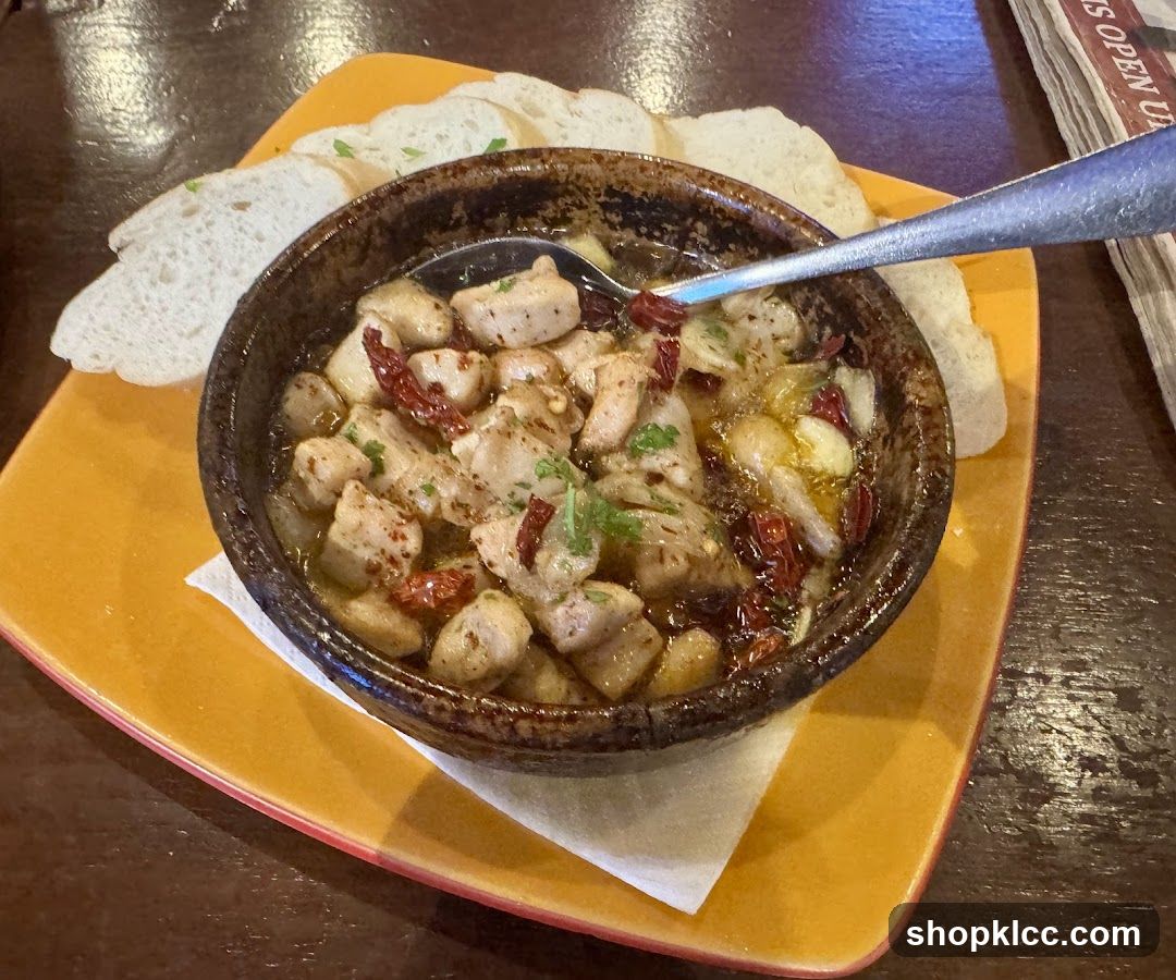 Bowl of Chicken with Dried Tomatoes and Bread