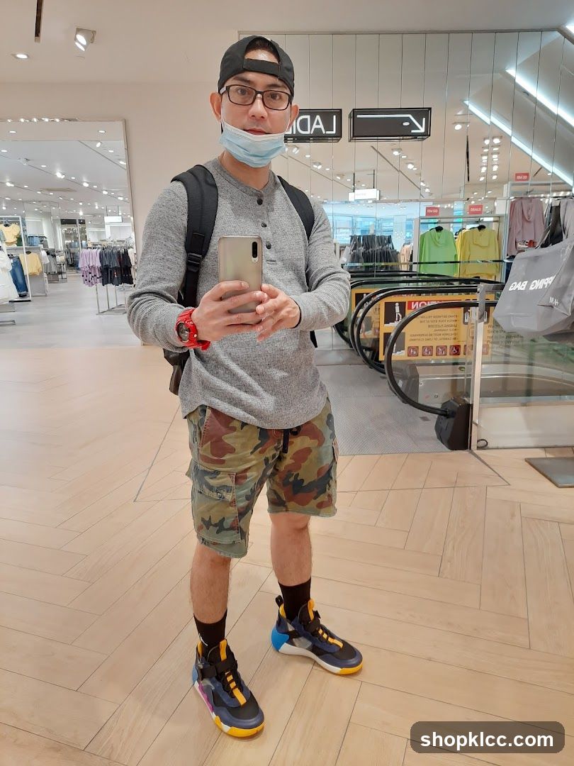 Man taking selfie in mall