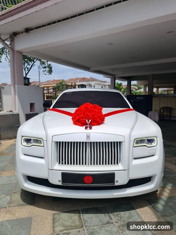 White Rolls-Royce with Red Bow