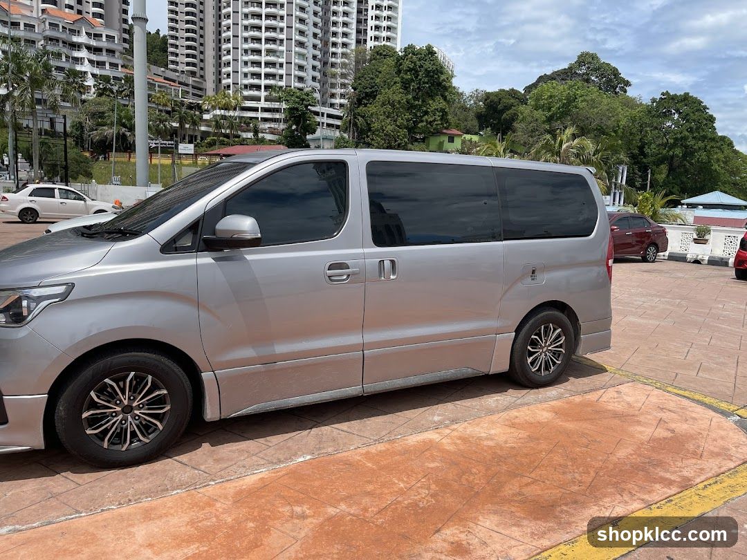 Silver Minivan Parked in Lot
