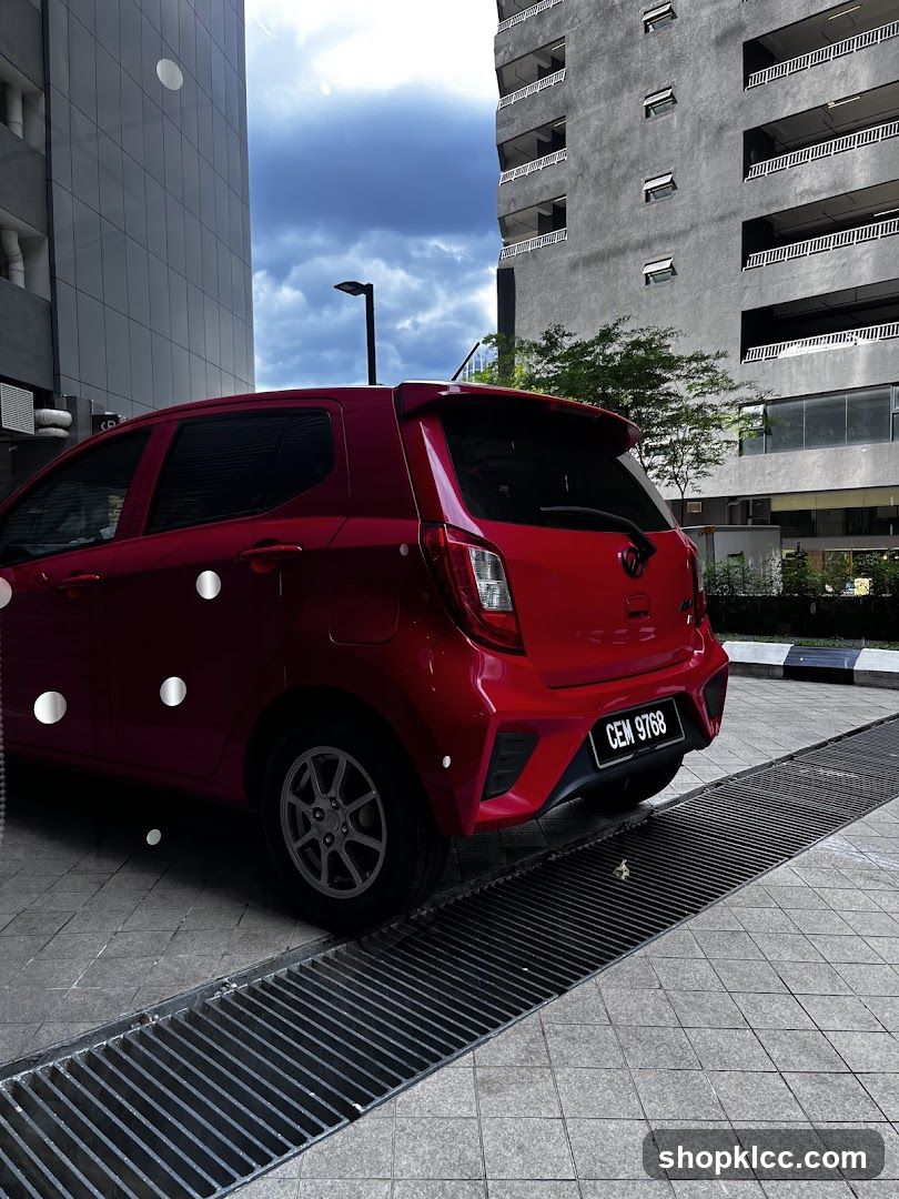 Red Hatchback Car Parked in Urban Setting