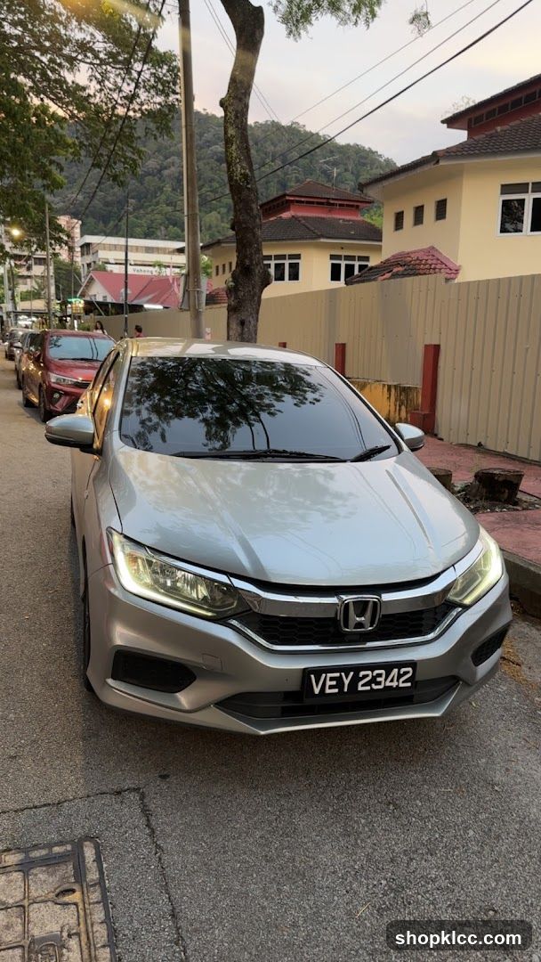 Silver Honda parked on street