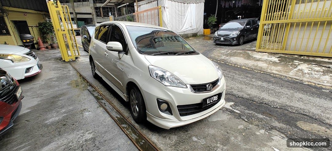 White MPV parked in lot