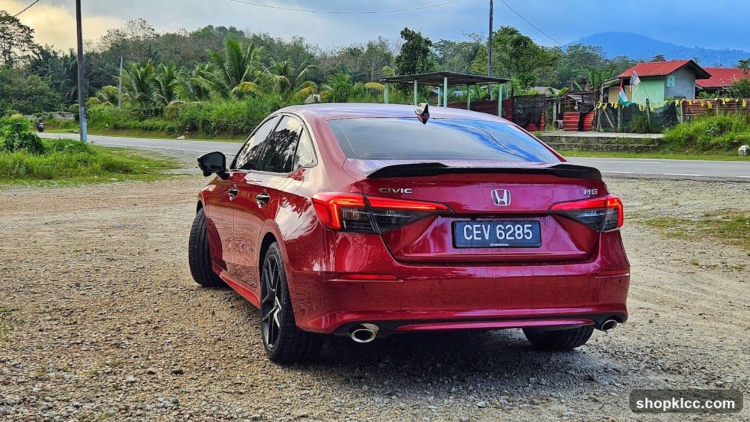 Red Honda Civic on Gravel Road
