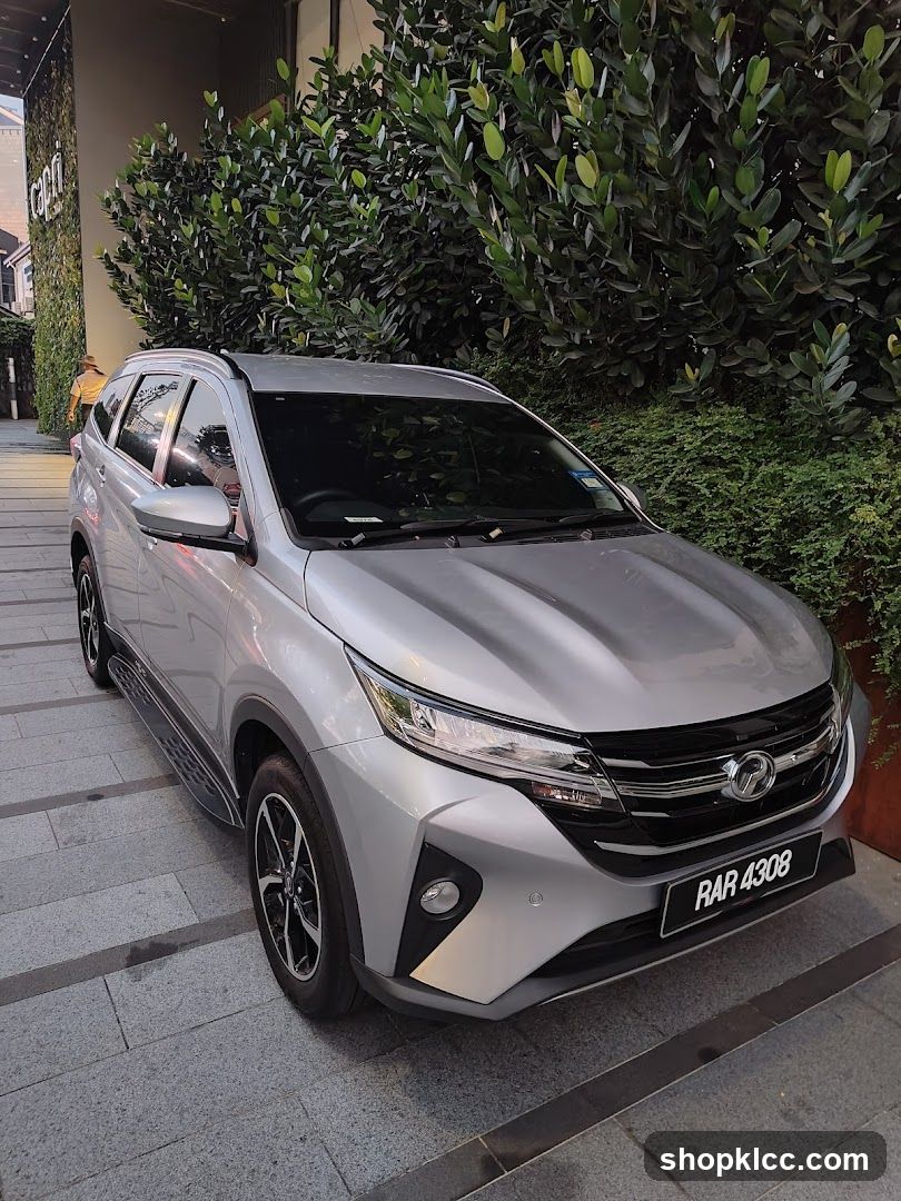 Silver SUV parked outside building