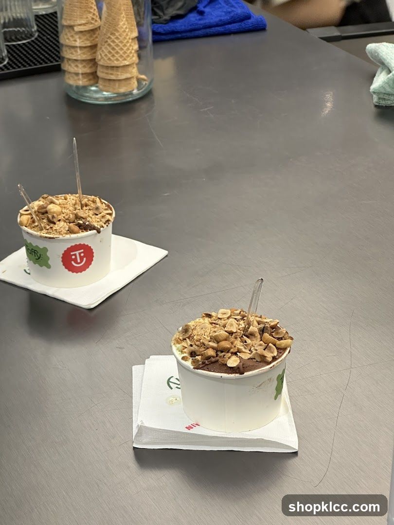 Two cups of gelato with toppings