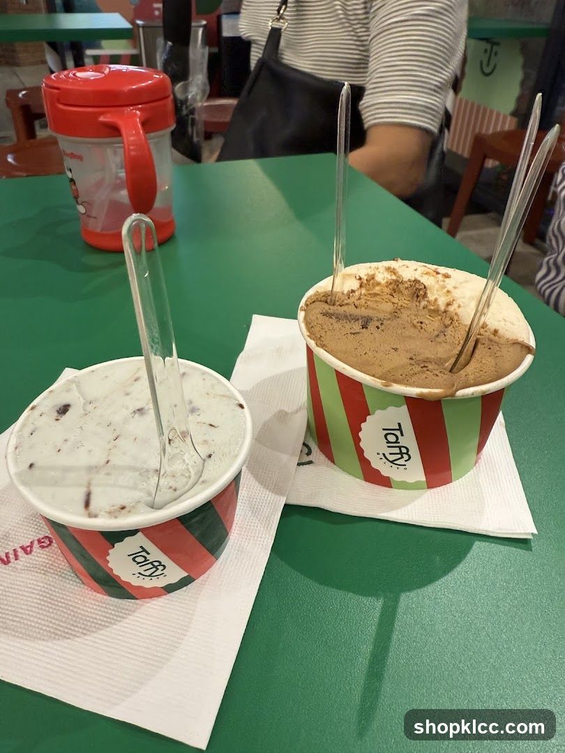 Two cups of gelato on a green table
