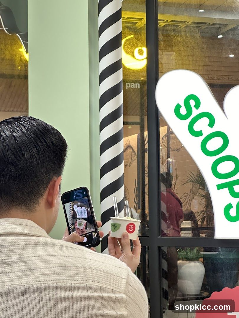 Person taking a photo of ice cream