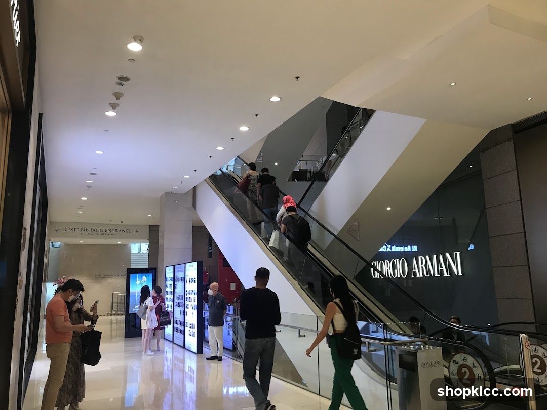 Shopping Mall Interior with Escalators and Storefronts
