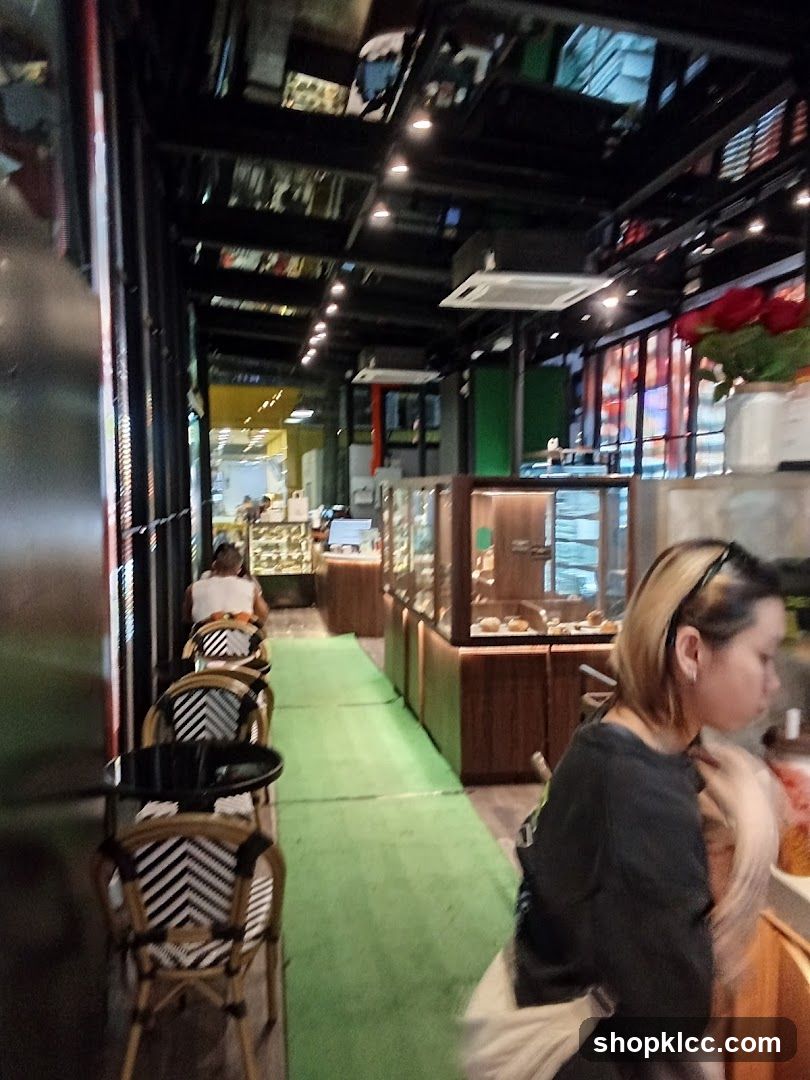 Interior of a cafe with seating and display cases