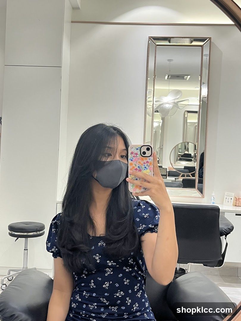 Woman taking a selfie in a salon