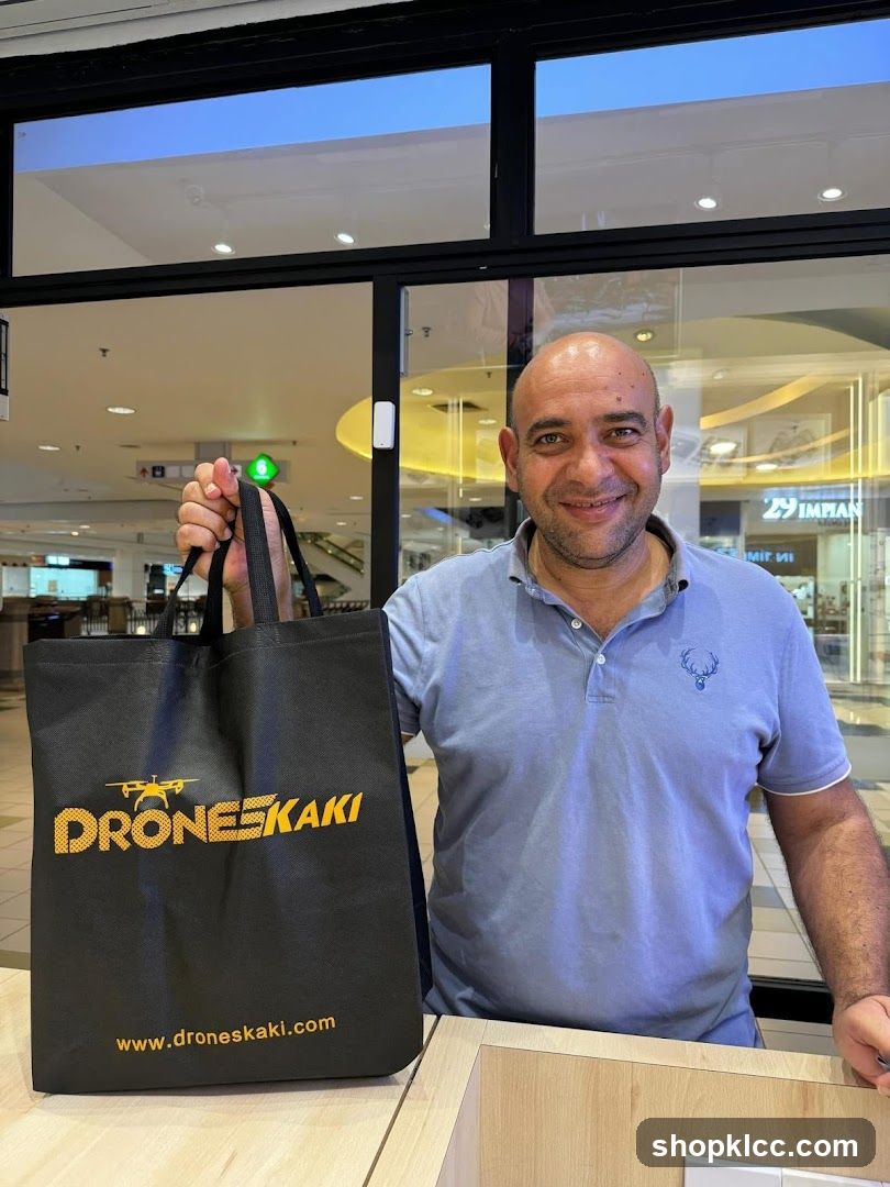 Man with Drone Shop Bag
