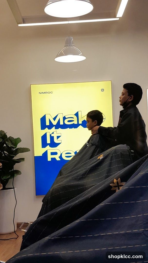 Barber cutting a boy's hair