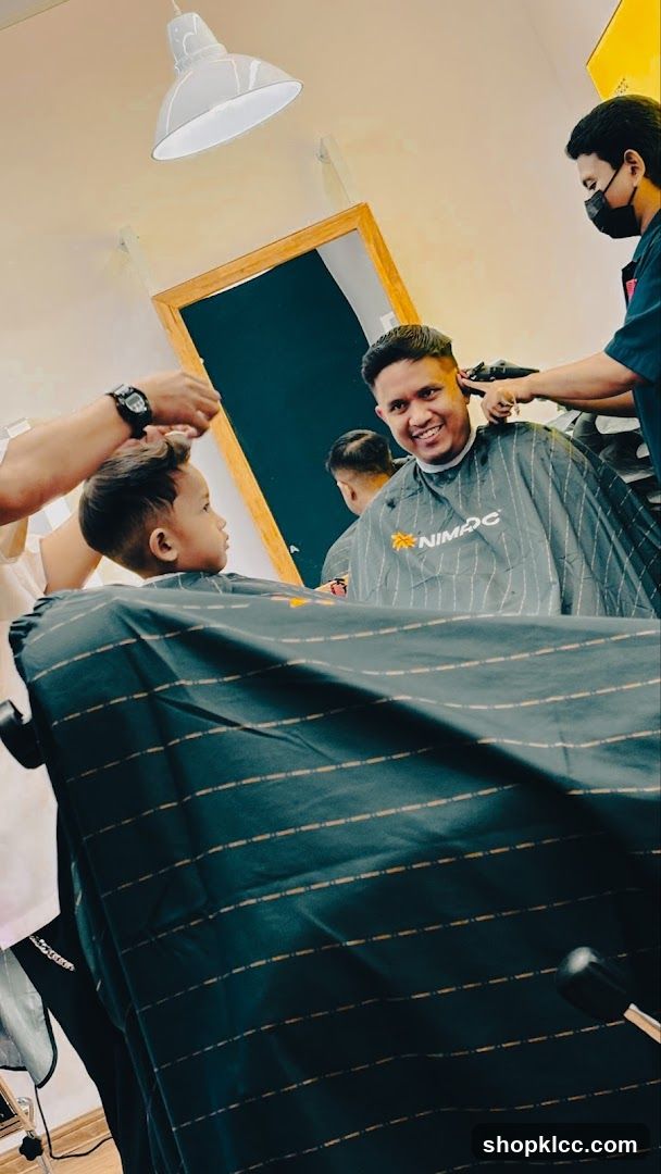 Barbershop interior with clients and barbers