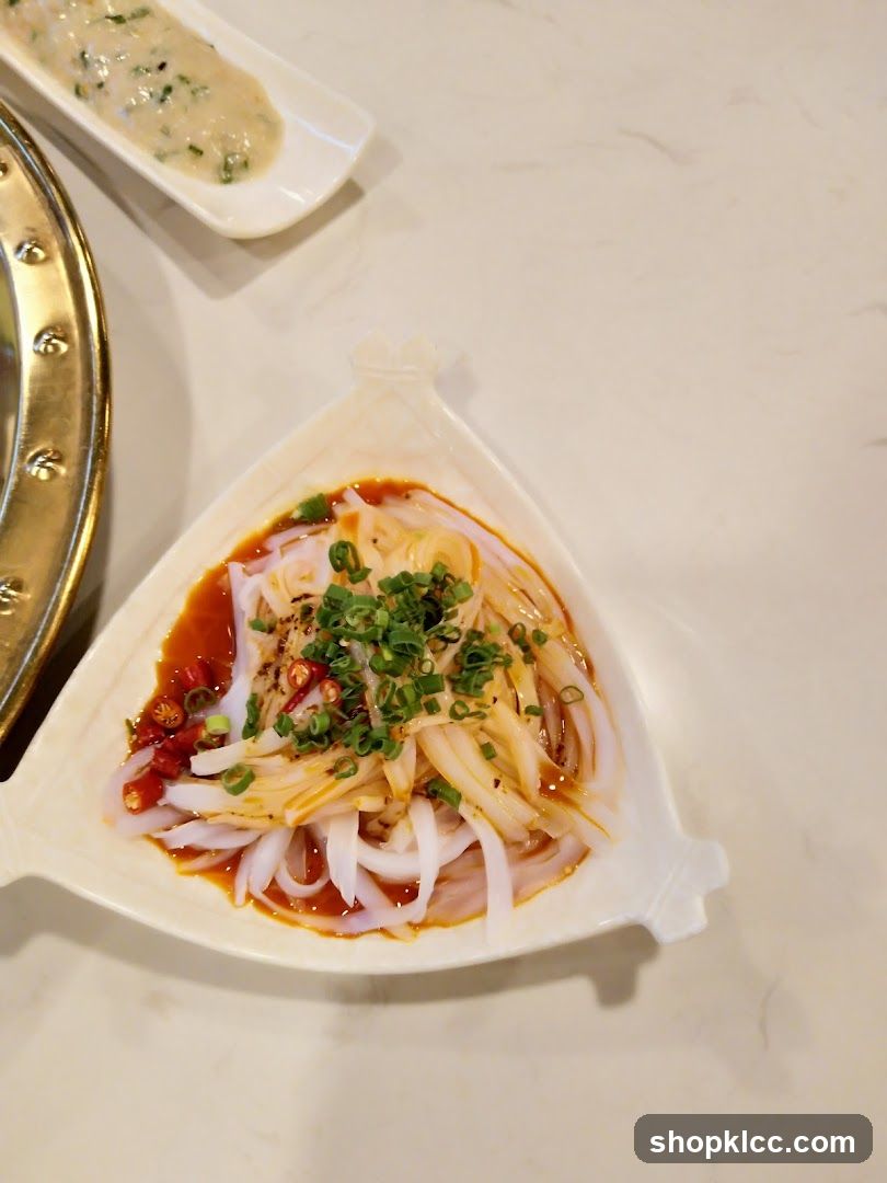 Dish with sliced ingredients and sauce