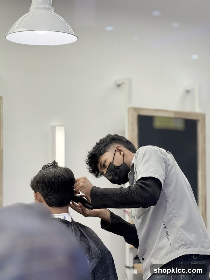 Barber cutting client's hair
