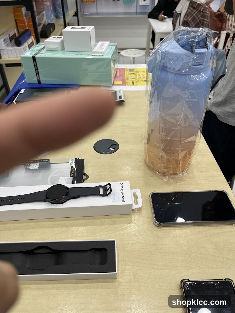 Table with electronics and water bottle