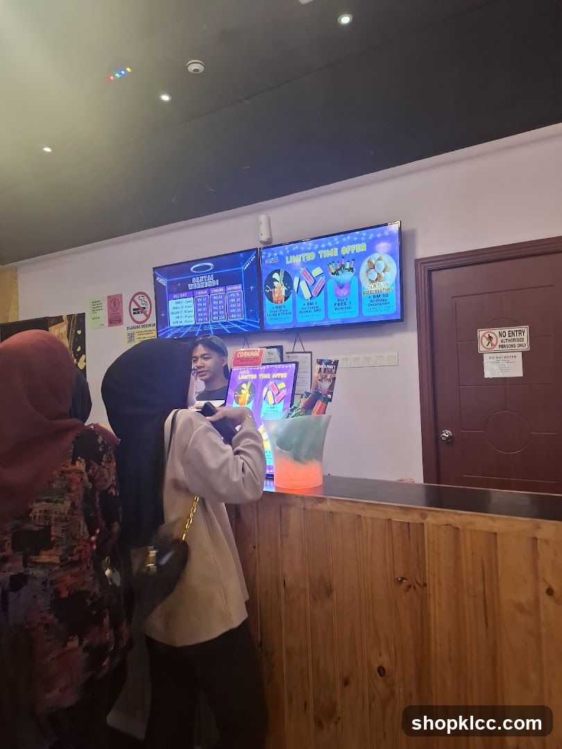 Counter with digital menus and customers