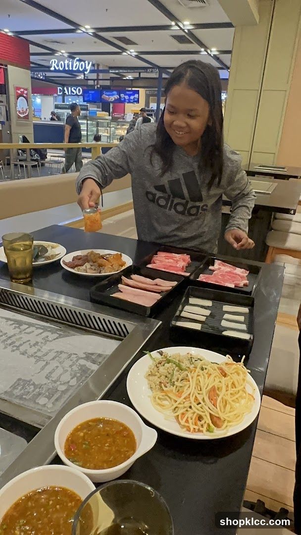 Girl at a Buffet