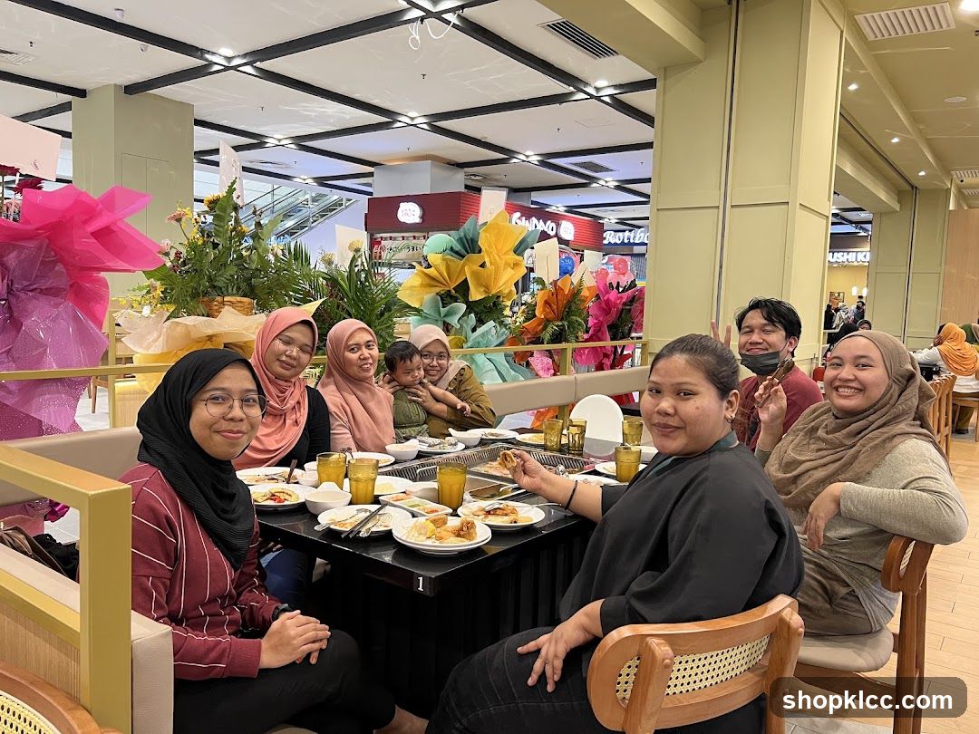 Group of people enjoying a meal at a restaurant