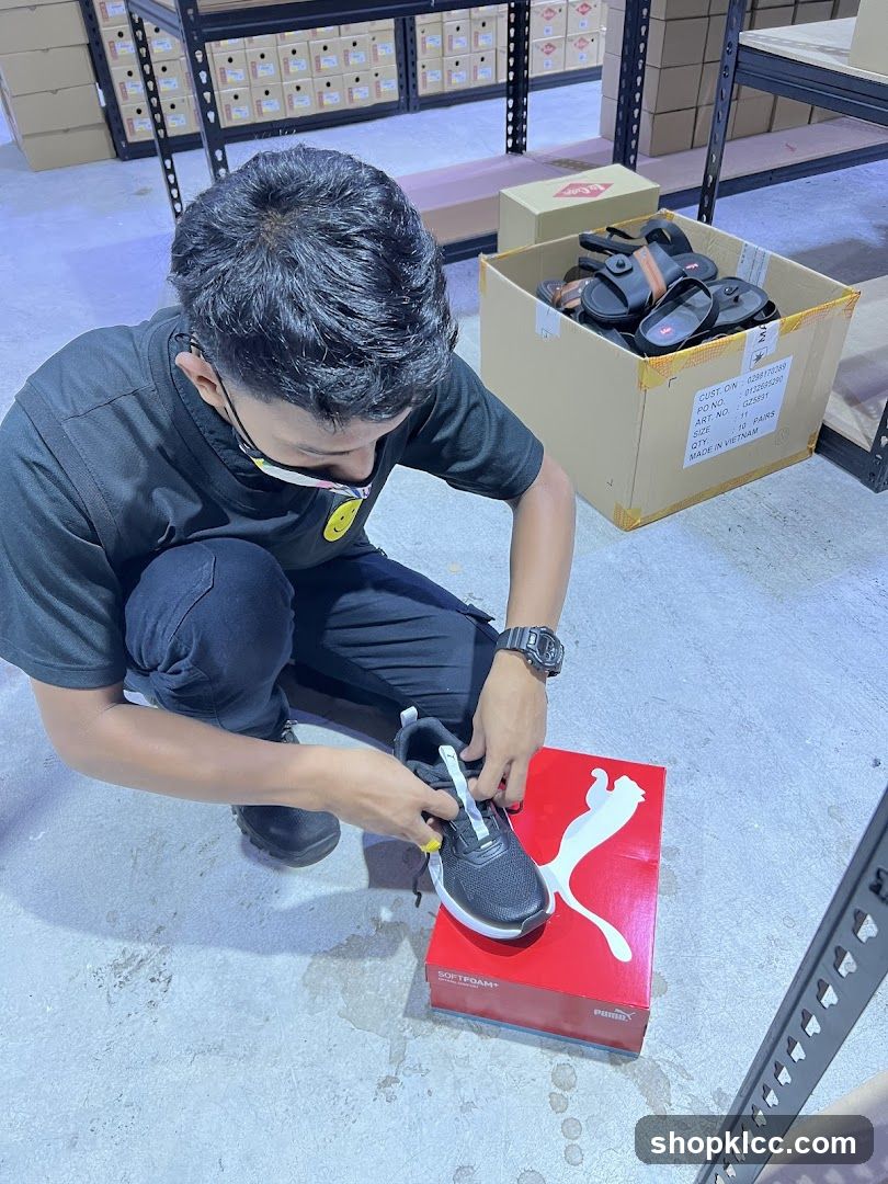 Worker Inspecting Shoes in Warehouse