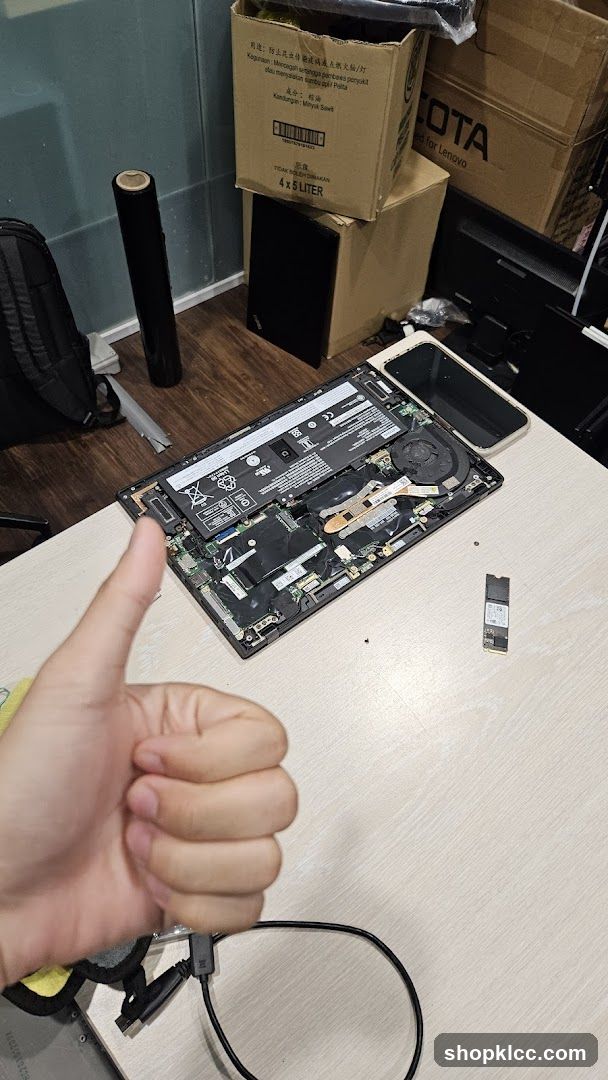 Disassembled Laptop on Workbench