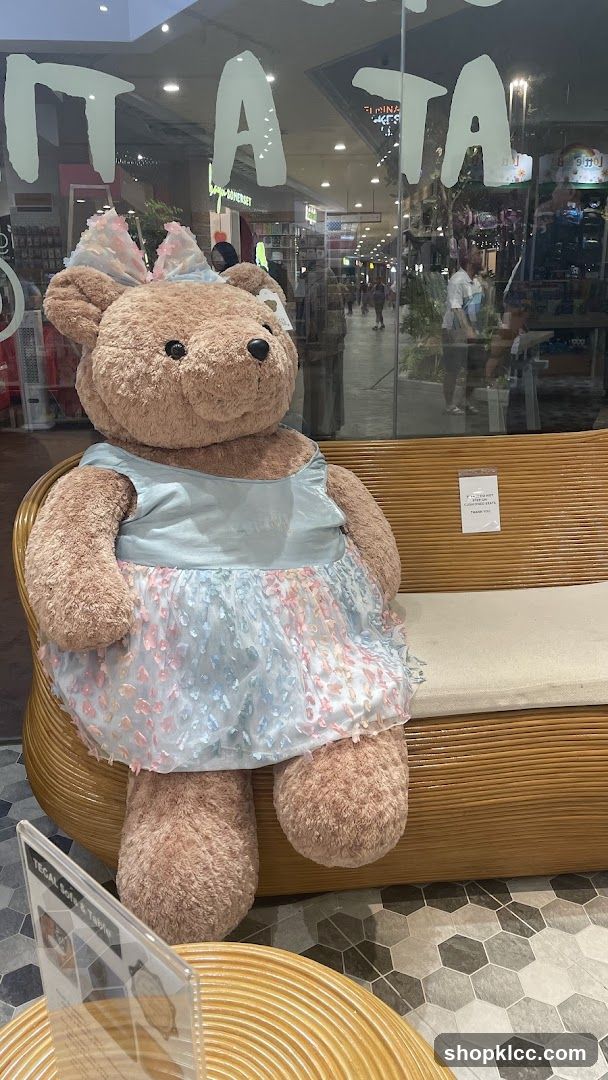 Giant Teddy Bear on Bench