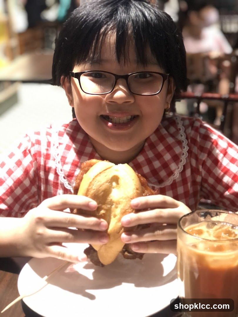 Girl with a sandwich and drink