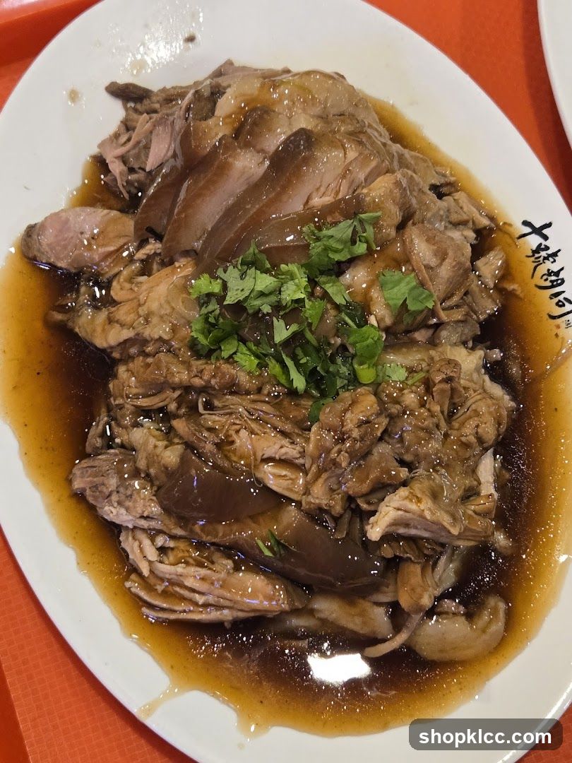 Sliced Meat Dish with Sauce and Garnish
