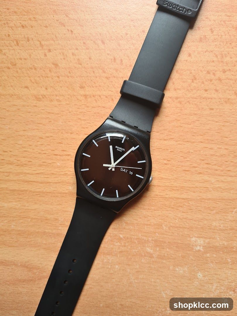 Swatch Watch on Wooden Surface