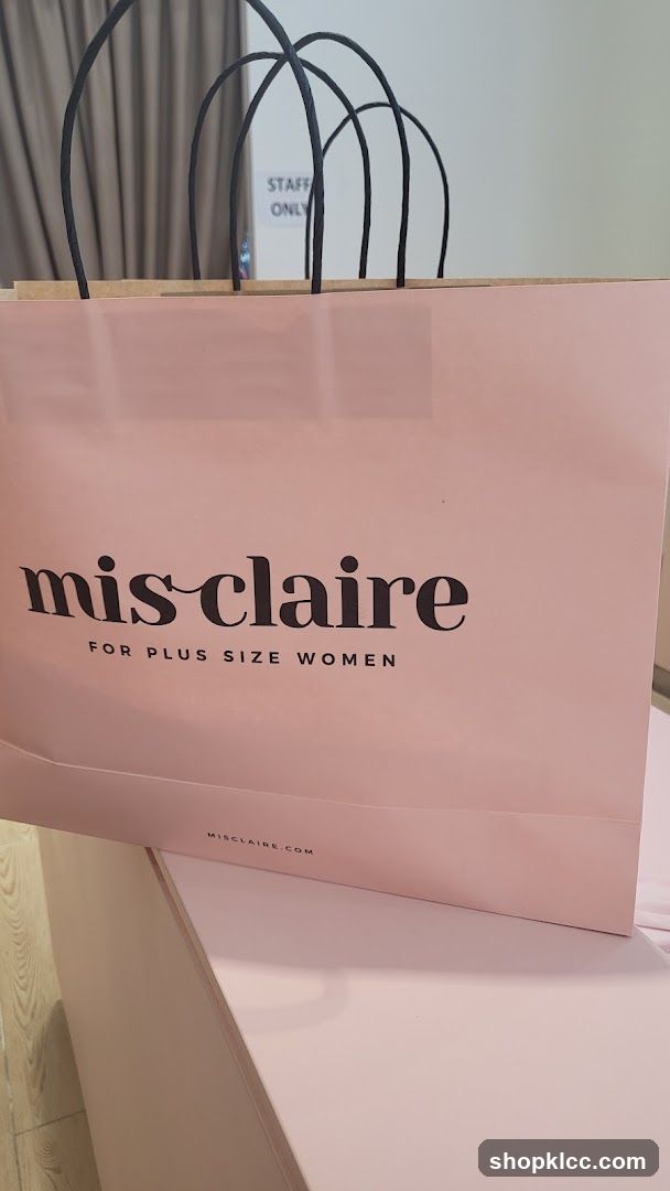 Pink shopping bag with "mis claire" logo