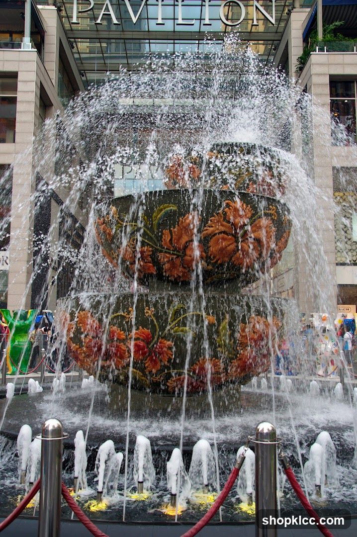 Fountain with floral patterns in urban plaza