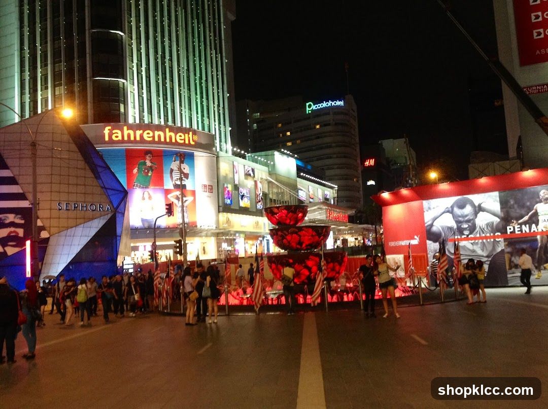 Night City Street Scene with Storefronts and Crowds