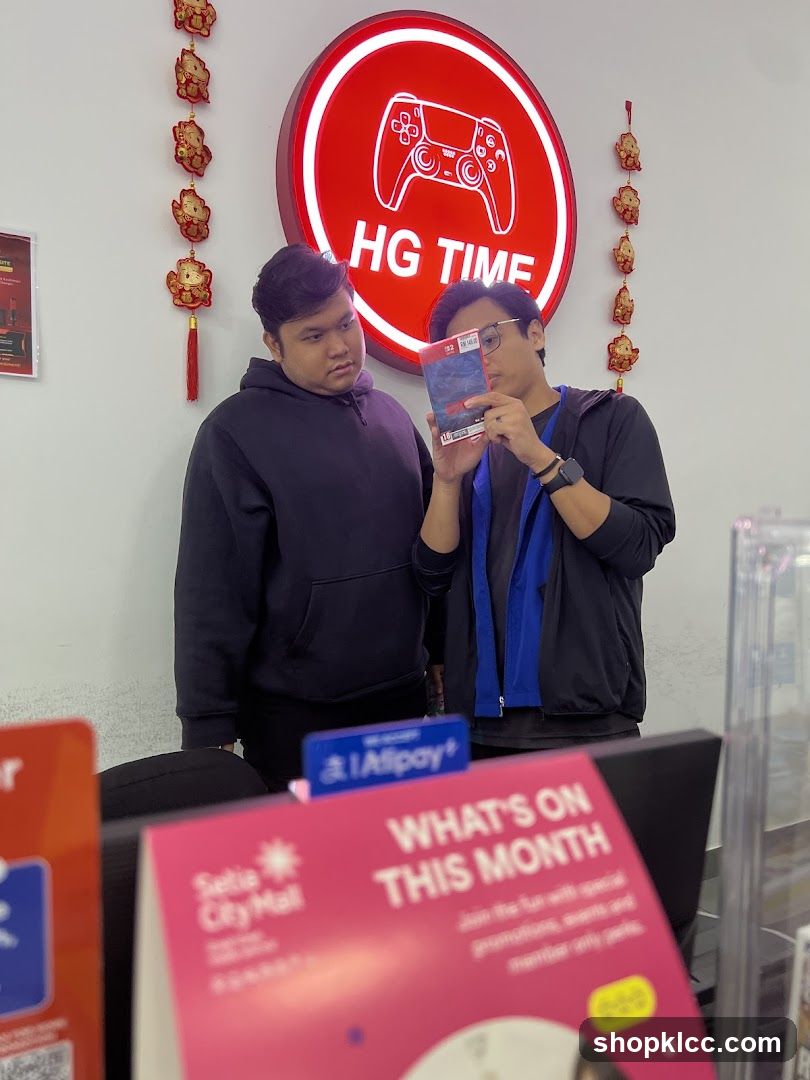 Two men looking at a game case
