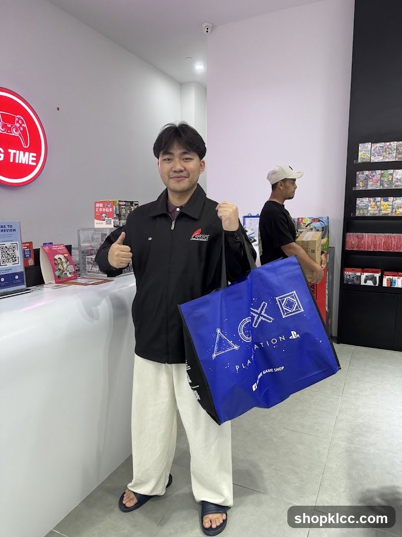 Man holding a PlayStation bag in a game store