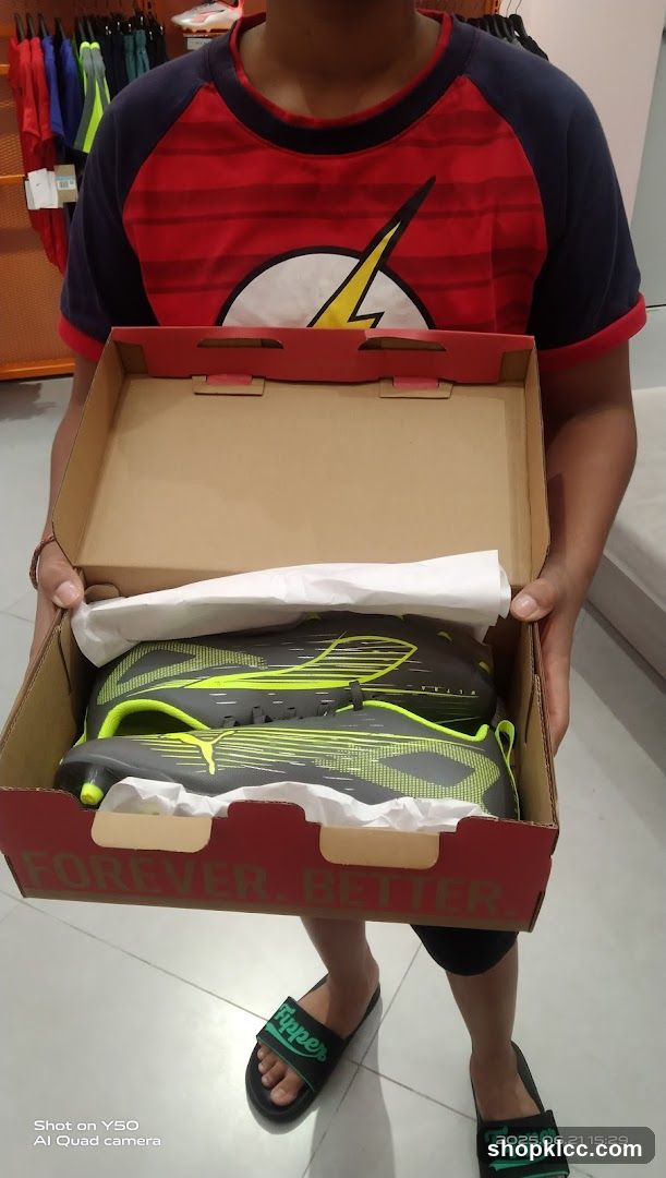 Person holding a shoe box